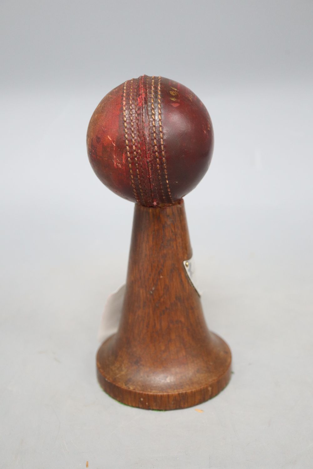 A mid 20th century cricket trophy, with silver plaque, height 18cm